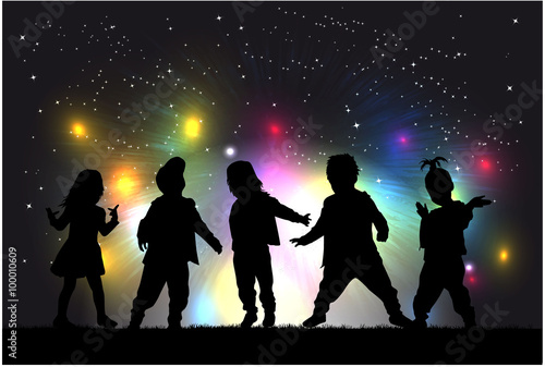 Fireworks show . Children silhouettes.