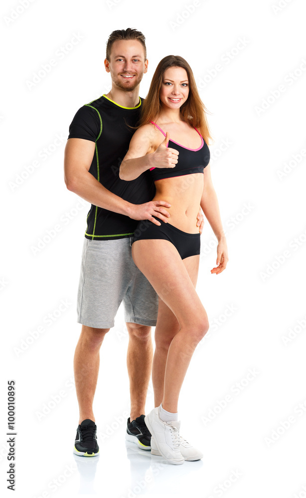 Athletic man and woman after fitness exercise with thumbs up on Athletic man and woman after fitness exercise with thumbs up on