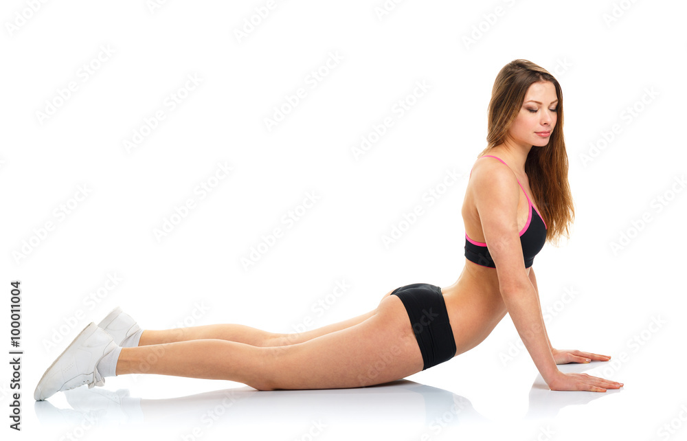 Happy athletic woman doing sport exercise, isolated on white