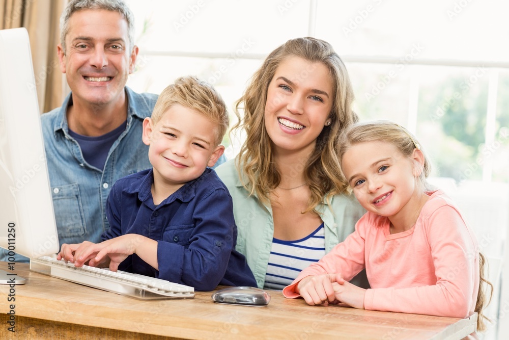 Happy family using the computer Happy family using the computer