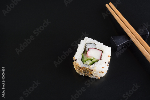 Sushi on black plate