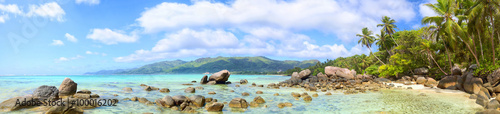 Tropical beach panorama with palms and rocks, Mahe Island, Seychelles photo