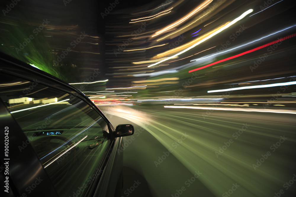Night drive with car in motion.