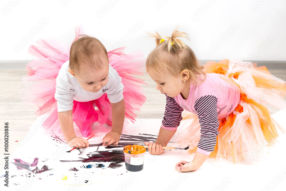 Fototapeta premium Children, little girls paint colors