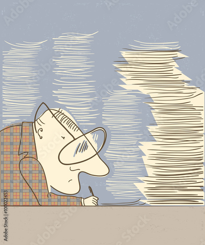 Man writing at table in an office work