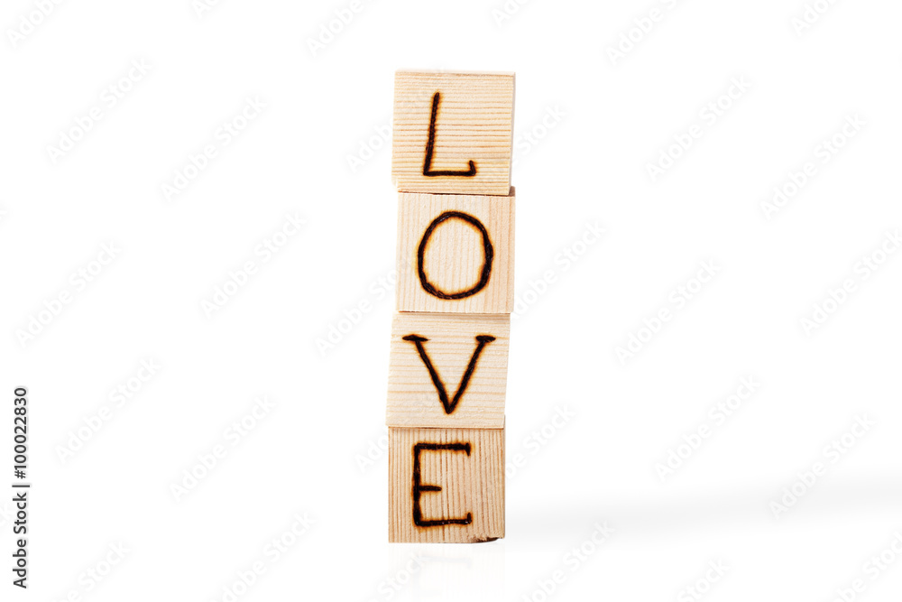 Romantic inscription of letters on light wooden cubes isolated o Romantic inscription of letters on light wooden cubes isolated o