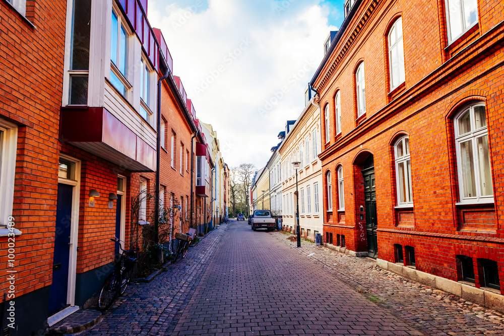 Street with old nice colorful houses in historical center of Malmo, Sweden