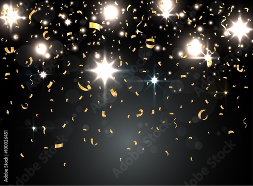 Gold confetti isolated on black background