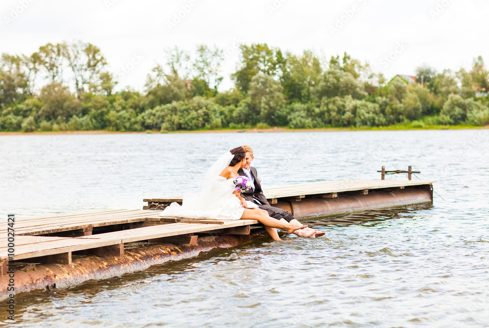  wedding couple  on the pier near big lake