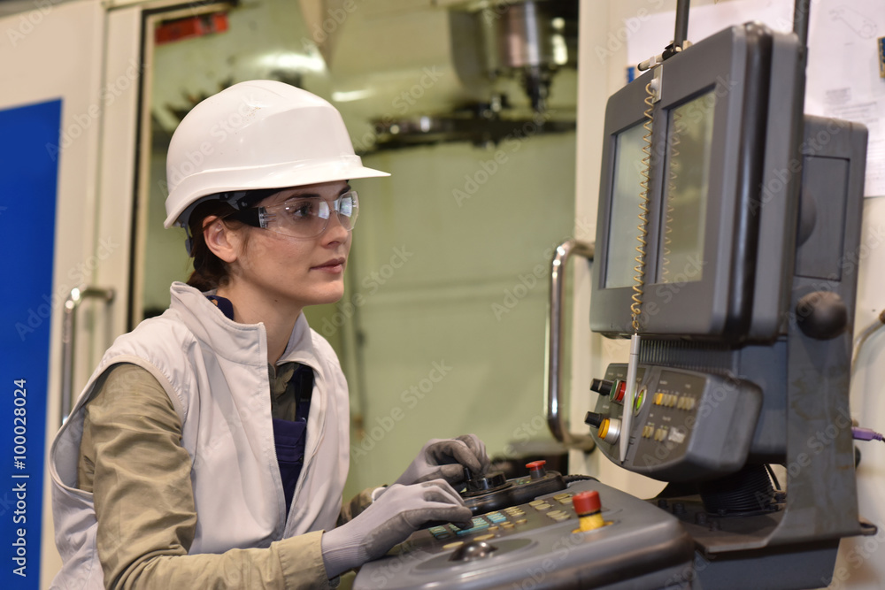 Industrial worker programming electronic machine Industrial worker programming electronic machine