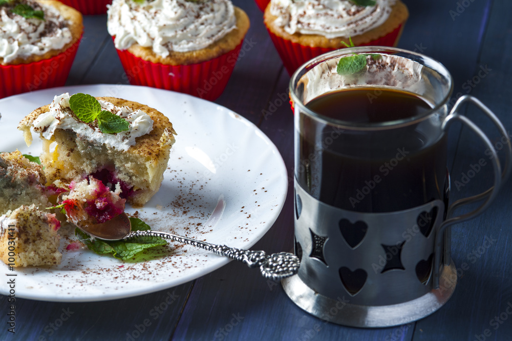 Muffin with cherry and pineapple, cup of coffee