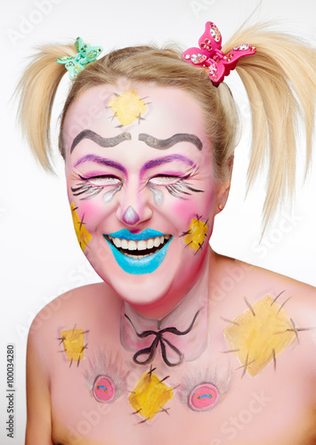 Fototapeta Naklejka Na Ścianę i Meble -  Beautiful Blonde smiling girl with funny body art isolated on white background