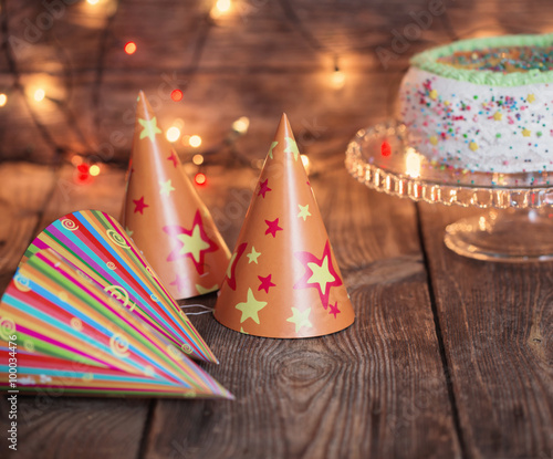 birthday cake on wooden table on light background