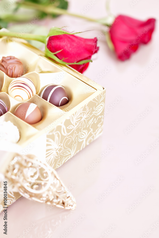 Chocolate truffles and red roses with copy space Chocolate truffles and red roses with copy space