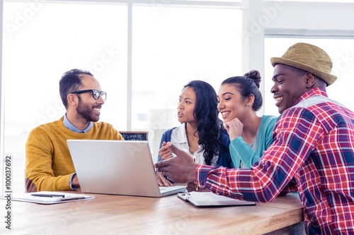 Business people discussing on laptop © WavebreakmediaMicro