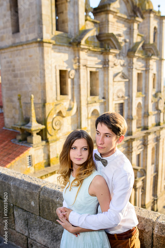 Happy young couple stands on background Porto