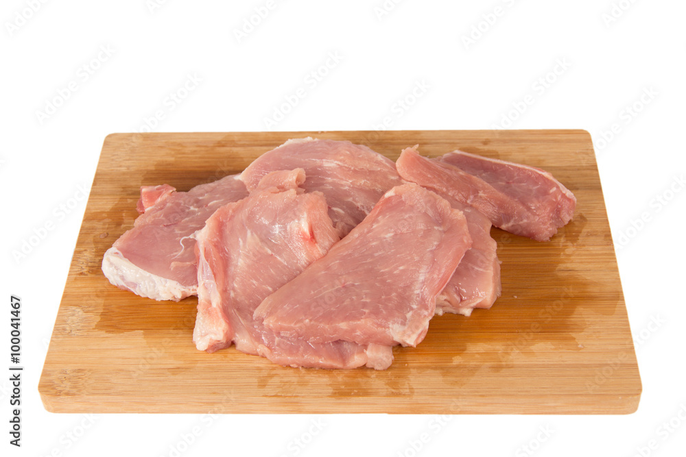 Raw piece of meat on a wooden board on a white background Raw piece of meat on a wooden board on a white background