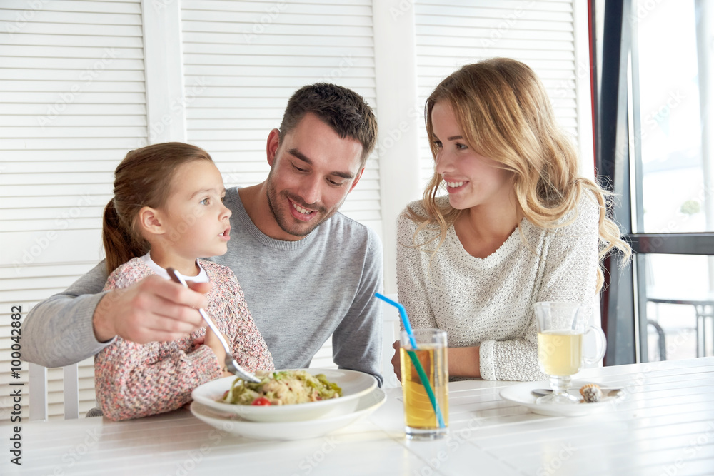 happy family having dinner at restaurant or cafe happy family having dinner at restaurant or cafe