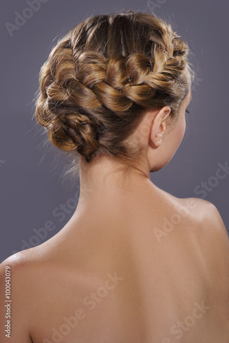 Back view of a beautiful trendy greek braids hairstyle