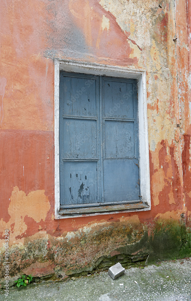 boarded up window in an old building