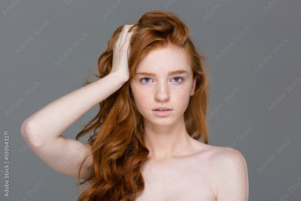 Fototapeta premium Beauty portrait of tender woman with beautiful long red hair