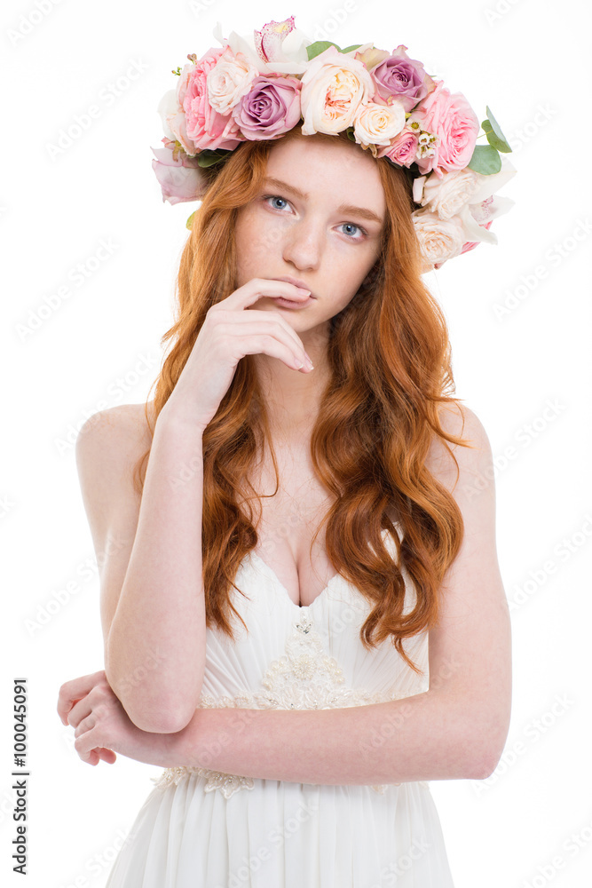 Beautiful redhead woman with wreath from flowers on head Beautiful redhead woman with wreath from flowers on head