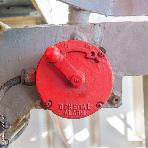 Vintage red manual general alarm in oil rig