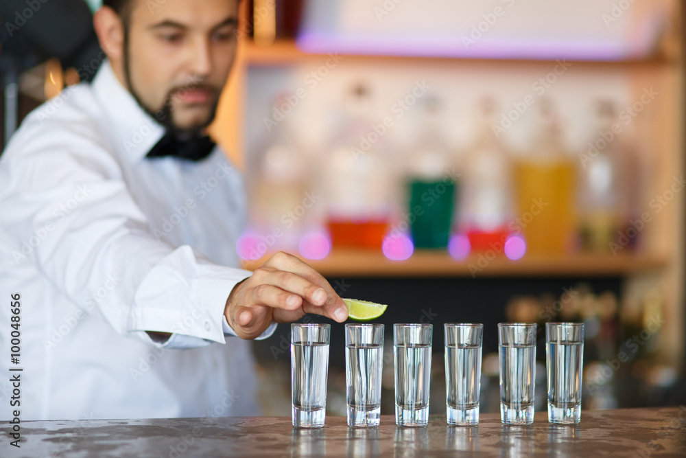 Barman at work, preparing cocktails. Barman at work, preparing cocktails.