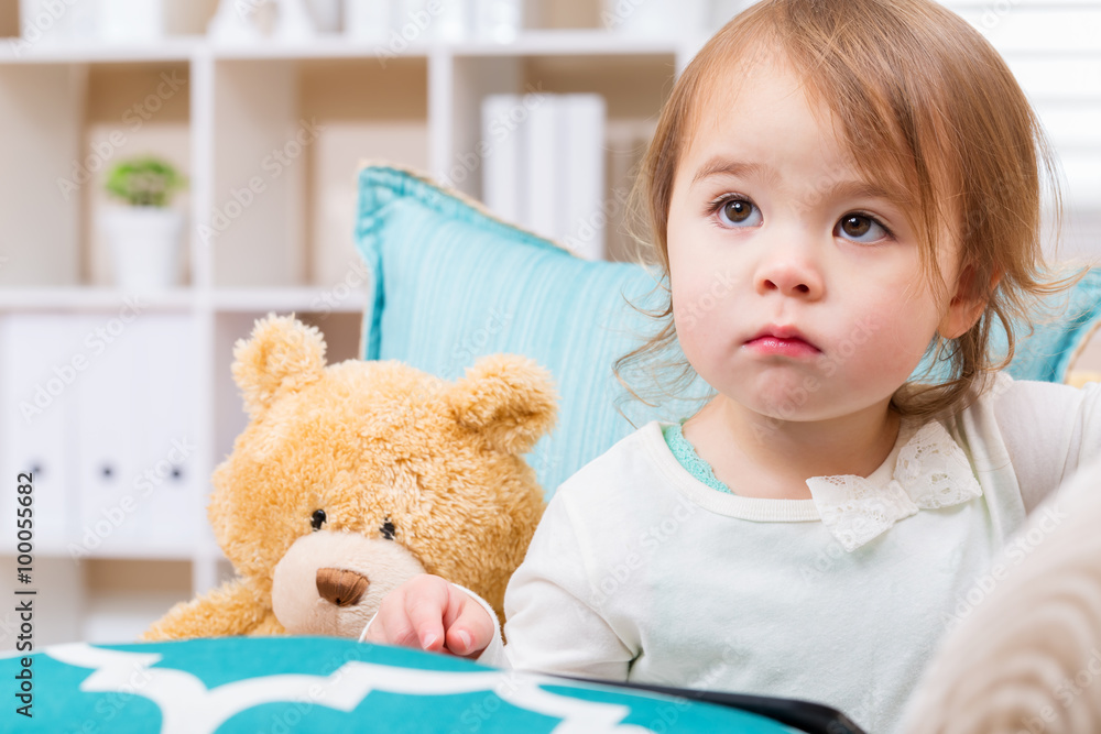 Toddler girl with her teddy bear and tablet pc Toddler girl with her teddy bear and tablet pc
