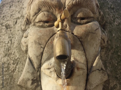 Old fountain with running water