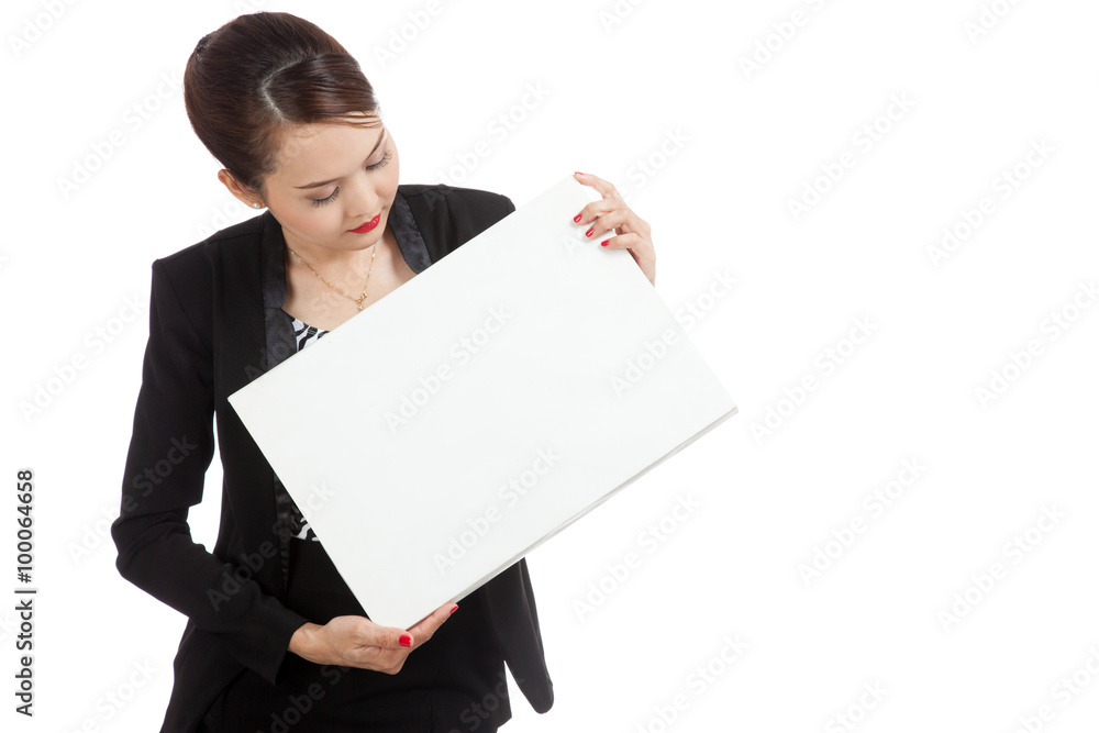 Young Asian business woman with white blank sign Young Asian business woman with white blank sign
