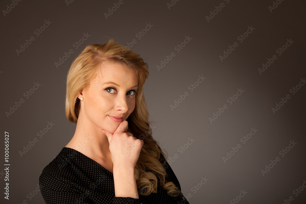 Pretty pensive caucasian blonde business woman looking into copy Pretty pensive caucasian blonde business woman looking into copy