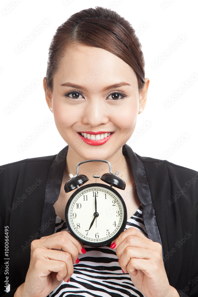 Young Asian business woman smile with a clock Young Asian business woman smile with a clock