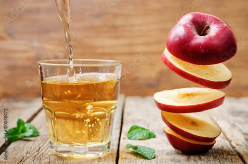 flying slices of apple and apple juice