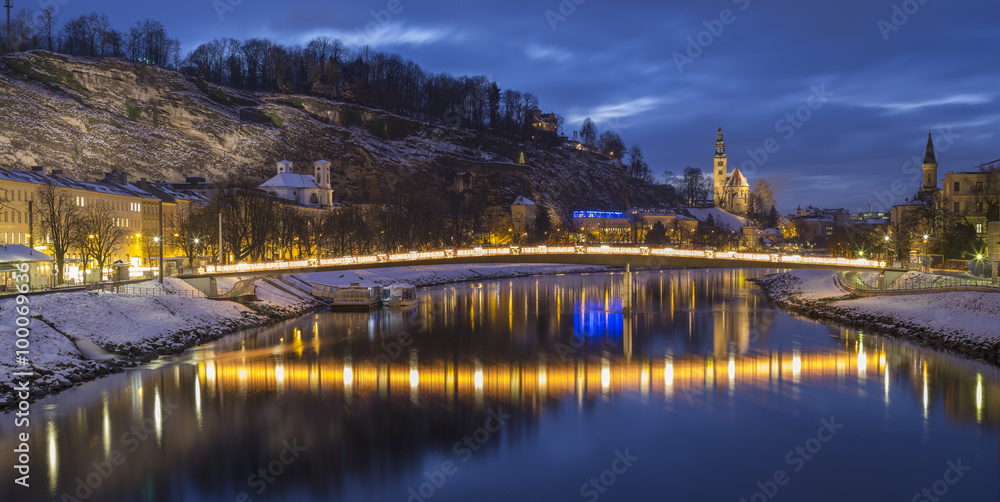 golden bridge and reflections in the water in austrian city