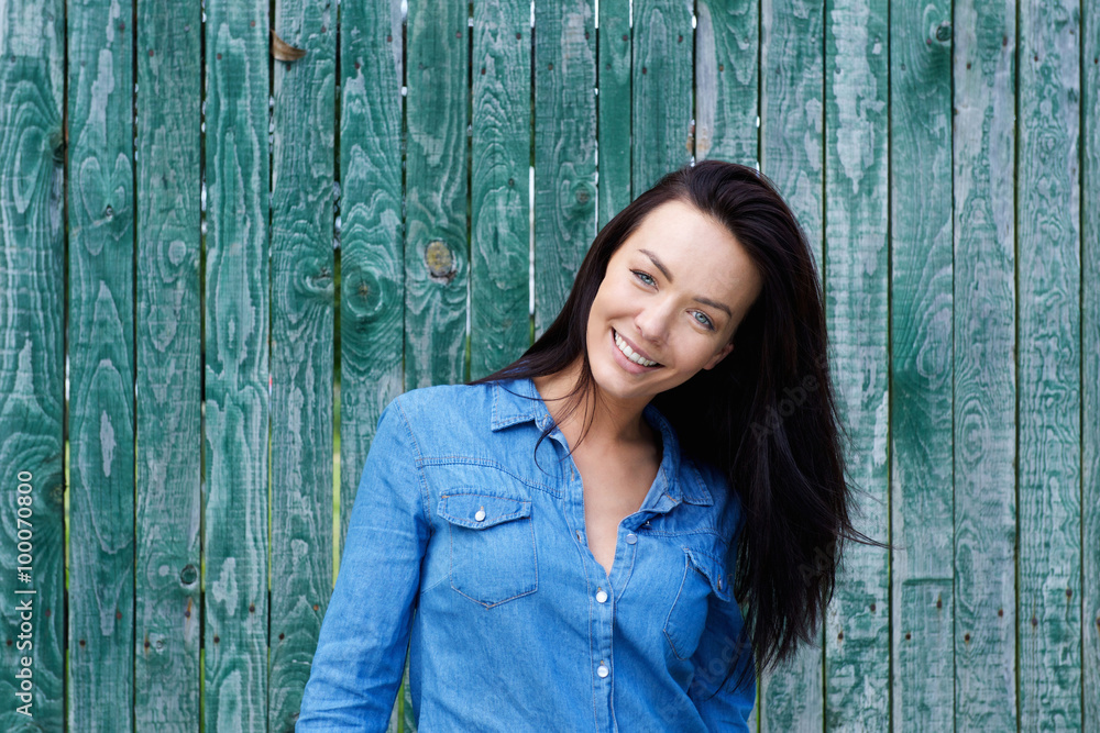 Smiling brunette woman with blue shirt Smiling brunette woman with blue shirt