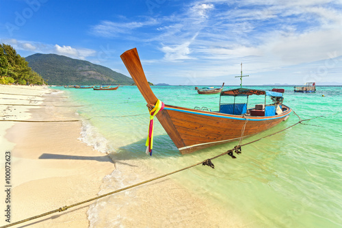 Long tail boat at a beautiful beach, Thailand. © MaciejBledowski