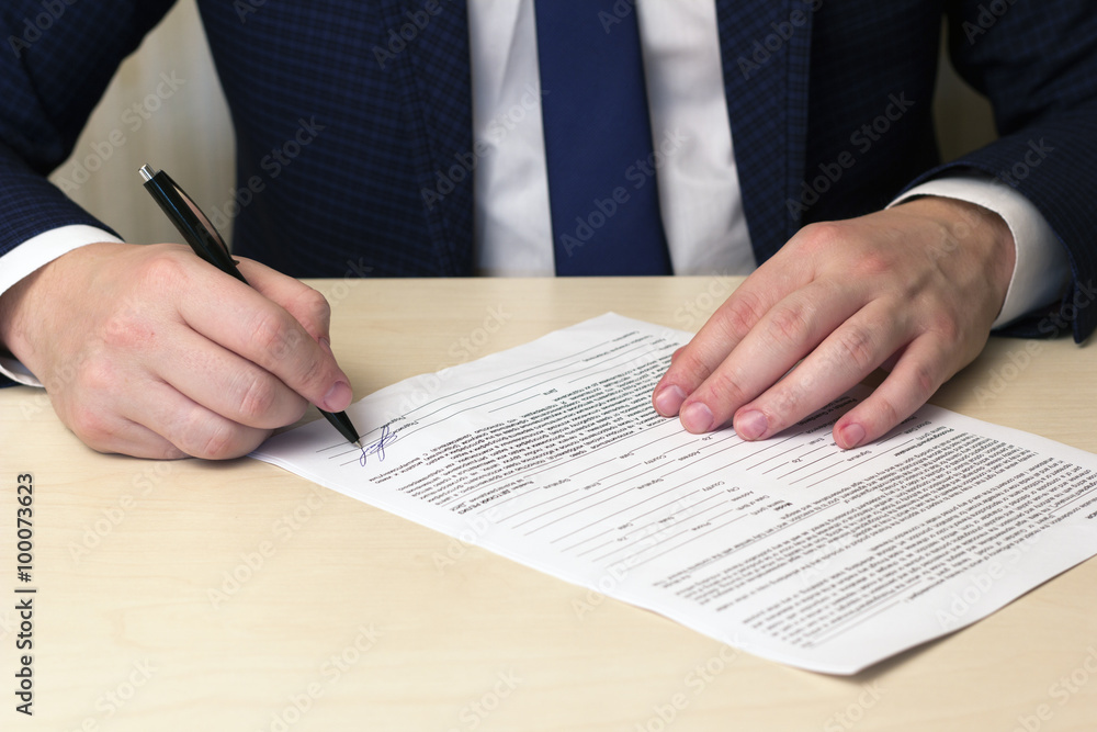 signing a contract man signing a contract man