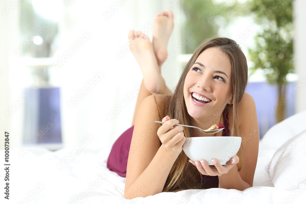Healthy girl eating cereals at breakfast Healthy girl eating cereals at breakfast