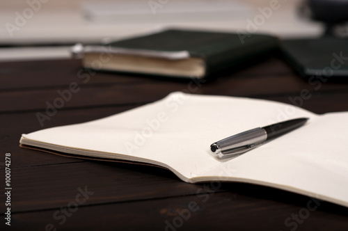 pen on an open notebook closeup