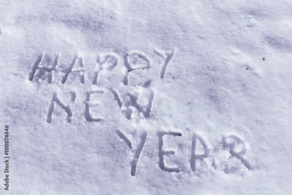 Happy New Year message on a snow field, filter applied