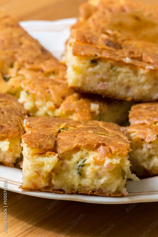 Macro view of homemade pie with ham cheese and cucumber