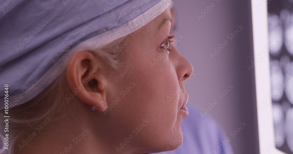 Closeup of woman surgeon looking at xrays Closeup of woman surgeon looking at xrays
