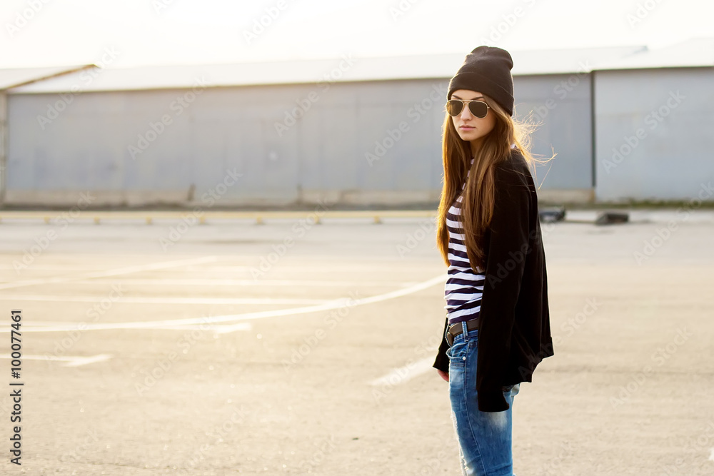 Fototapeta premium Outdoor fashion closeup portrait of nice pretty young hipster wo