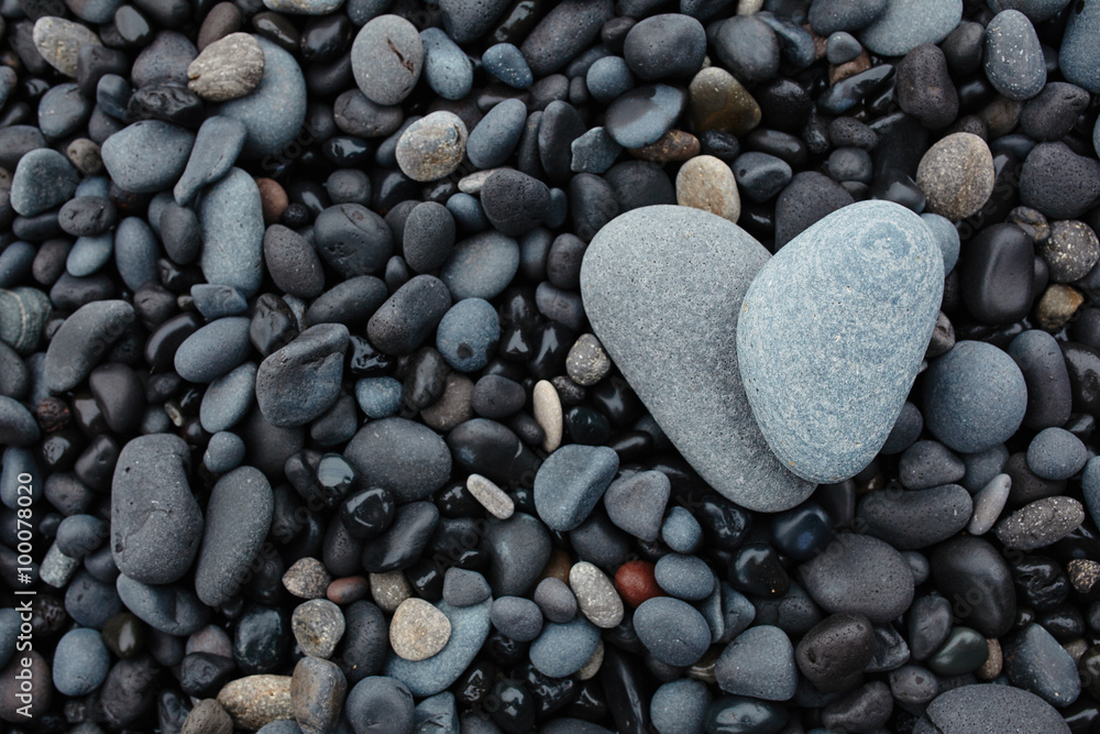 Grey stones in shape of heart on black volcanic beach in Iceland Grey stones in shape of heart on black volcanic beach in Iceland