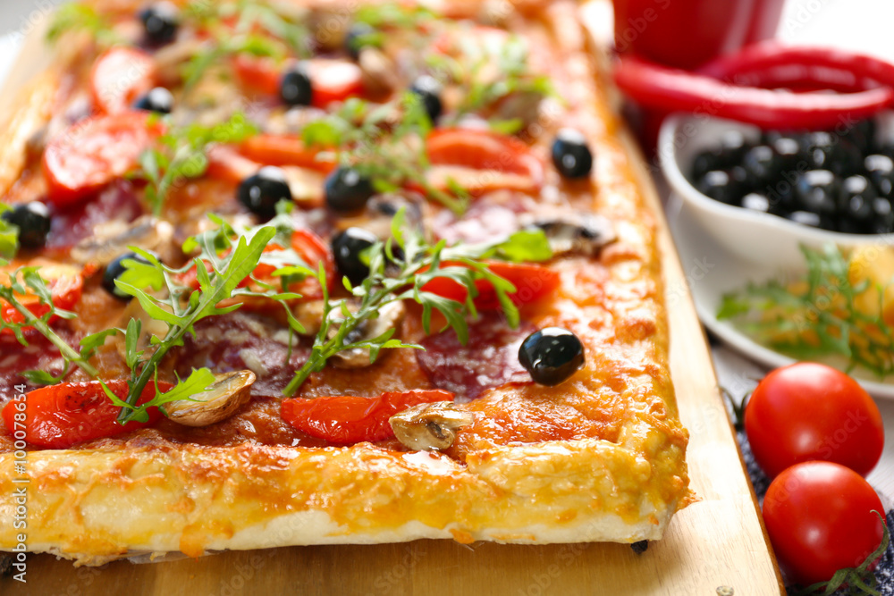 Rectangle delicious pizza on the table, close-up Rectangle delicious pizza on the table, close-up