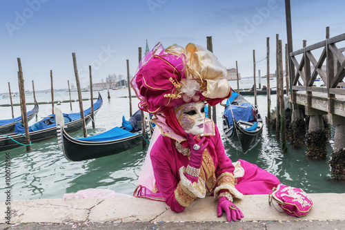 Carnival mask and gondolas in Venice