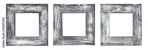 Three empty old weathered picture frames isolated on white.