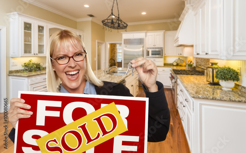 Young Woman Holding Sold Si...