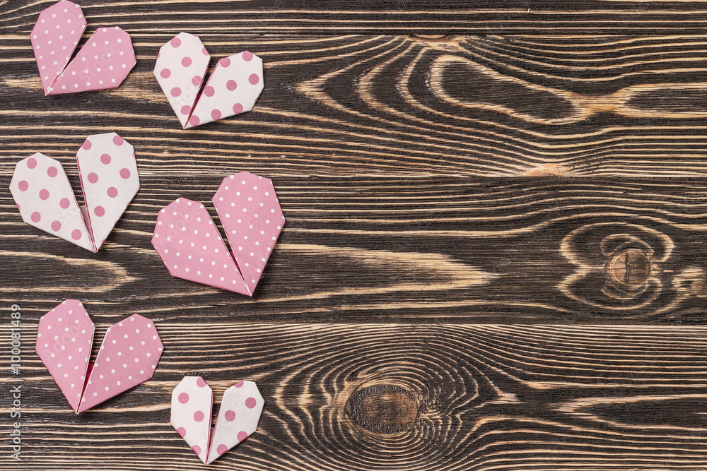 Fototapeta premium Handmade hearts against wood-grain wall